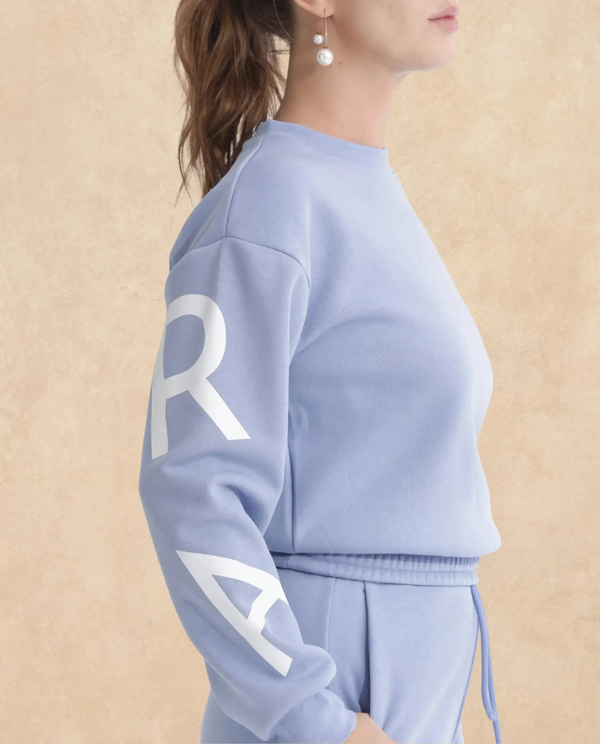 Rareism Articale Women Jonice Light Blue Poly Cotton Fabric Full Sleeves Crew Neck Regular Fit Graphic Print Cropped Sweatshirt