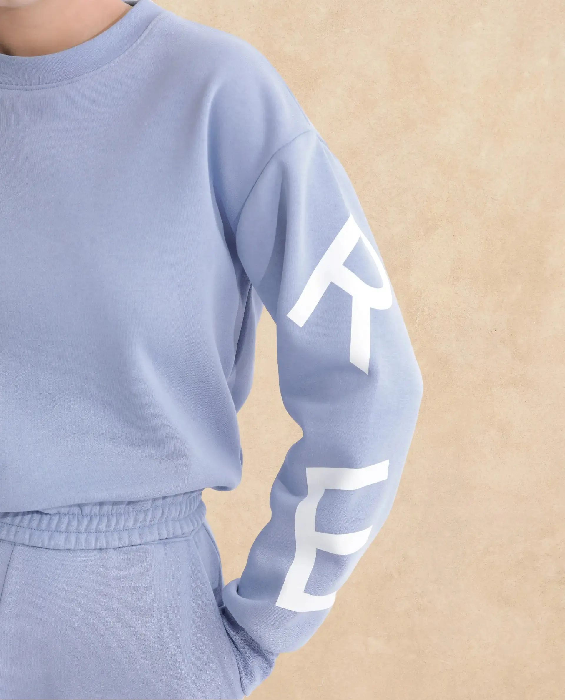 Rareism Articale Women Jonice Light Blue Poly Cotton Fabric Full Sleeves Crew Neck Regular Fit Graphic Print Cropped Sweatshirt
